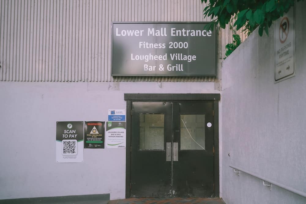 a building with a sign that says lower mall entrance